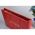 Gold Logo Hot Foiled Stamping Red Matt Coated Paper Bag with Cotton Rope Handles
